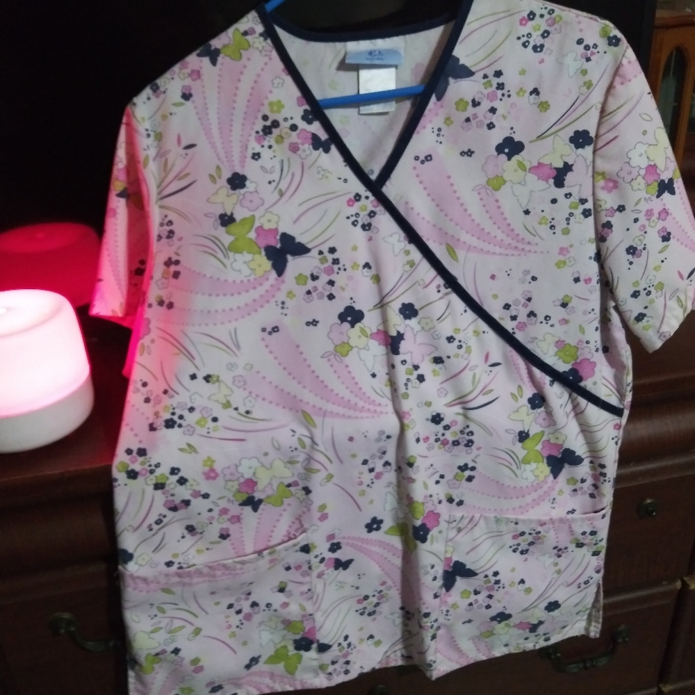 Beautiful scrub top. Never worn.